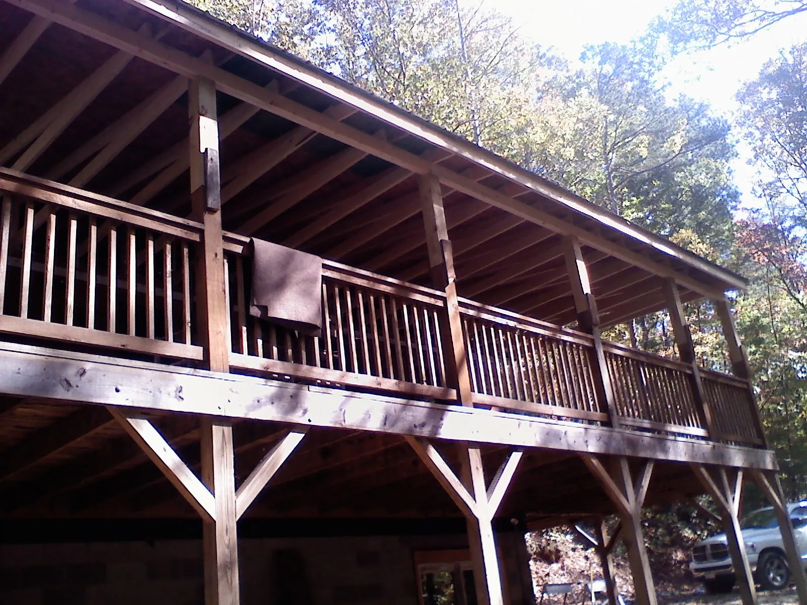 Timber framing under a new elevated porch and deck — Roof Leak Repair in New Lenox by Roofing Brothers